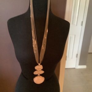 Chicos necklace with tags on the item. Pink and nice chain design